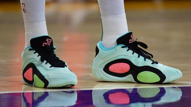 Boston Celtics forward Jayson Tatum's green and black Jordan Brand shoes.